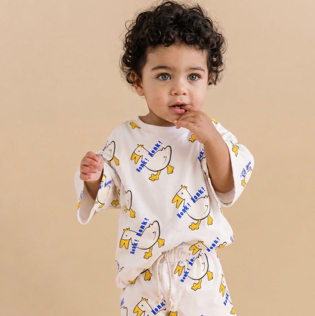 Child wearing the Nik and DELLE Honk Honk goose oversized cotton shirt and shorts set